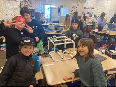 Students in class building objects