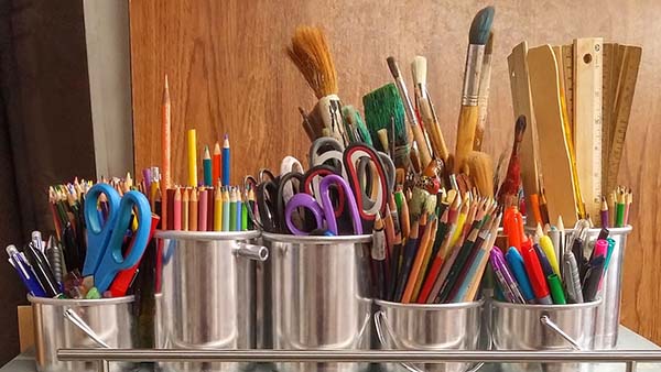picture of art supplies colored pencils scissors brushes