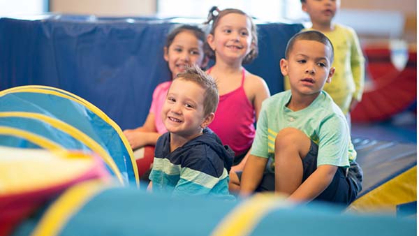 young kids smiling in the gym
