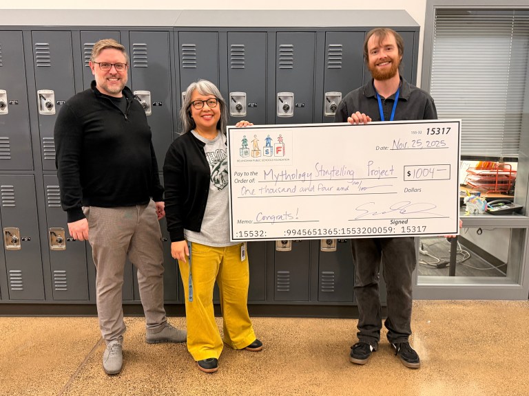 Bellingham Public Schools Foundation Staff present a check to Mythology Project grant recipients