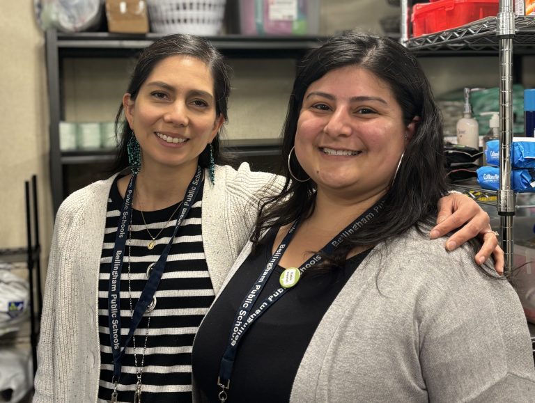 Evelyn Molina and Daniela Pearson from the Family Engagement Team smiling